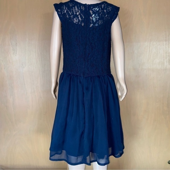 Guess Los Angeles baby lace dress has a gauze skirt just perfect for twirling. - Picture 3 of 8